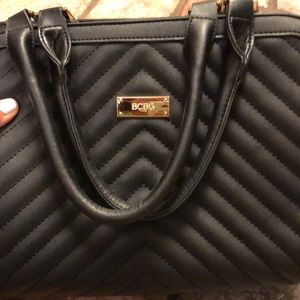 BCBG black purse with adjustable strap/gold detail